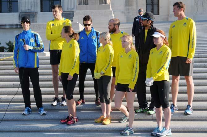 Members of the Louisiana Boston Marathon team stand before a crowd Saturday, April 20, 2013, at the steps of the Louisiana State Capitol for Baton Rouge Run for Boston, a 2.62 mile run organized by several local running clubs to support victims of the Boston Marathon bombing.
 