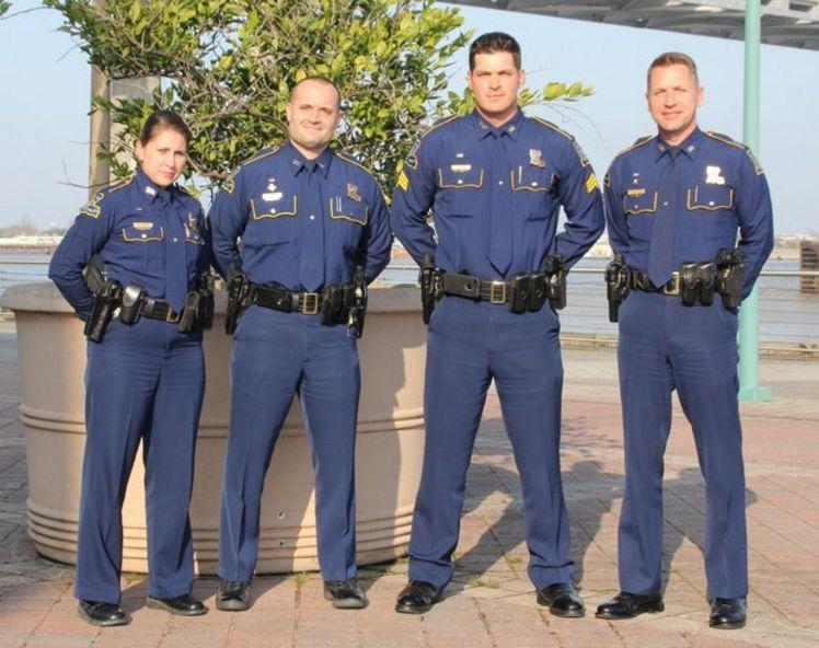 Officers of the Louisiana State Police Department display the uniforms that recently won them the title of best-dressed state agency, which was given by the North American Association of Uniform Manufacturers and Distributors.
 