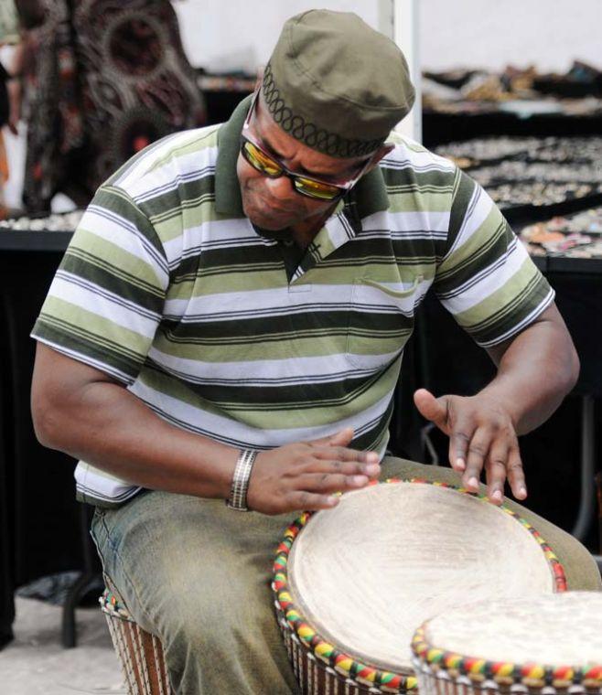 Shabazz plays the djembe drum April 27, 2013, at Festival International de Louisiane in Lafayette, La.
 