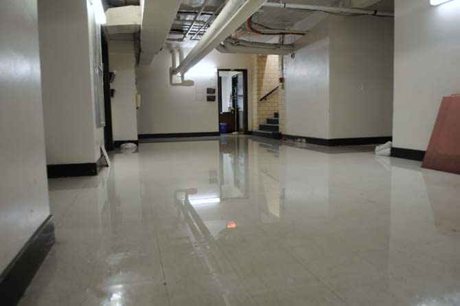 A large puddle spreads through the basement of Allen Hall on Wednesday, April 24, 2013.
 