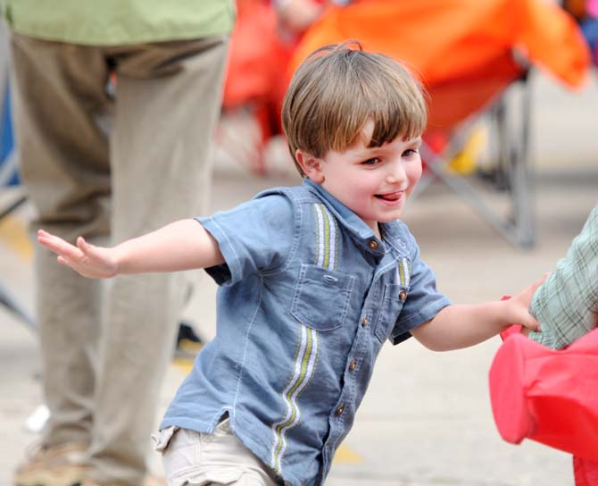 A child dances to music by Dennis Stoughmatt et l'Esprit Creole April 27, 2013, at Festival International de Louisiane in Lafayette, La.
 