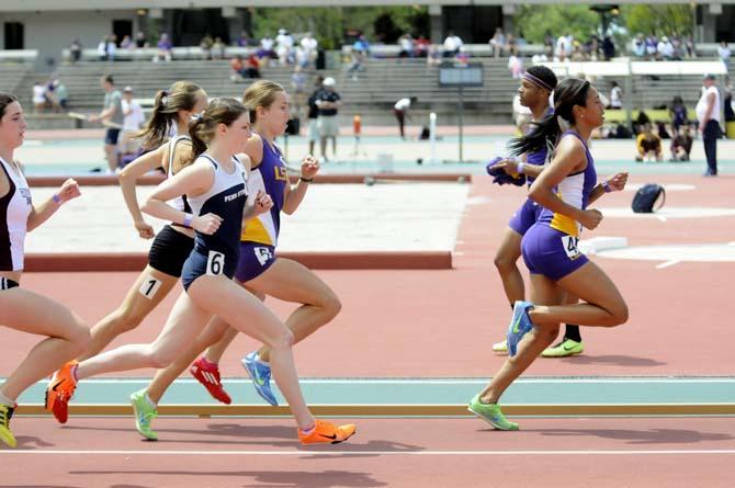 With LSU senior Charlene Lipse in the lead, LSU, Penn State, and Mississippi State runners sprint during the 1500 meter run Saturday, April 13, 2013.