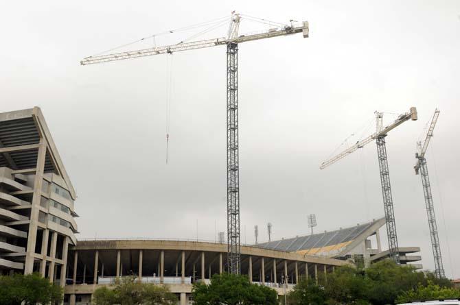 Three cranes rise above Tiger Stadium on Monday, April 15, 2013.
 