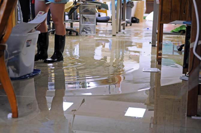 Mallory Estopinal, third year architecture student, stands in the flooded student studio space Wednesday, April 24, 2013 in the basement of Atkinson Hall.
 