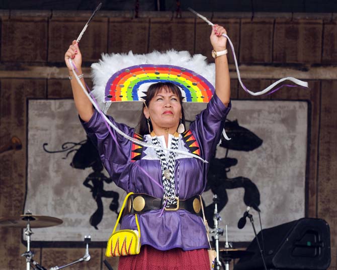 A dancer performs the Apache Rainbow Dance as part of the Stoney Creek Singers with Yellow Bird Indian Dancers performance Saturday, April 27, 2013 at the New Orleans Jazz &amp; Heritage Festival on the Fair Grounds Race Course.
 