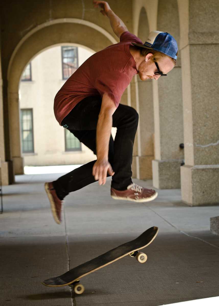 <p>Digital art junior Hunter Esmon pops a trick in the Quad.</p>