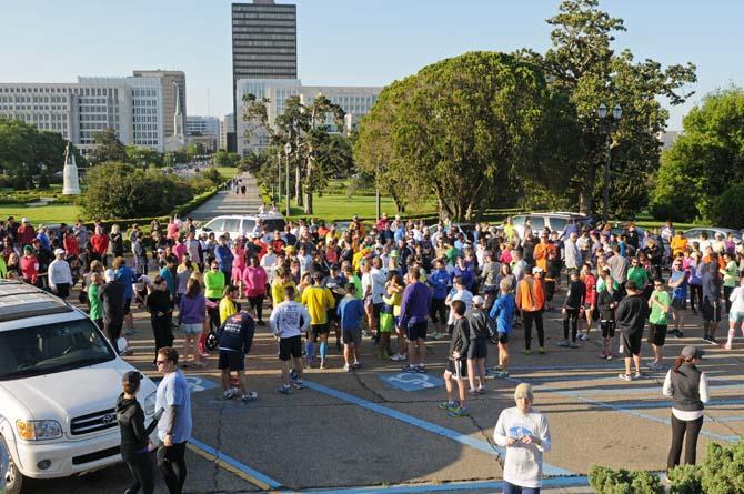 A crowd gathers Saturday, April 20, 2013, at the steps of the Louisiana State Capitol for Baton Rouge Run for Boston, a 2.62 mile run organized by several local running clubs to support victims of the Boston Marathon bombing.
 