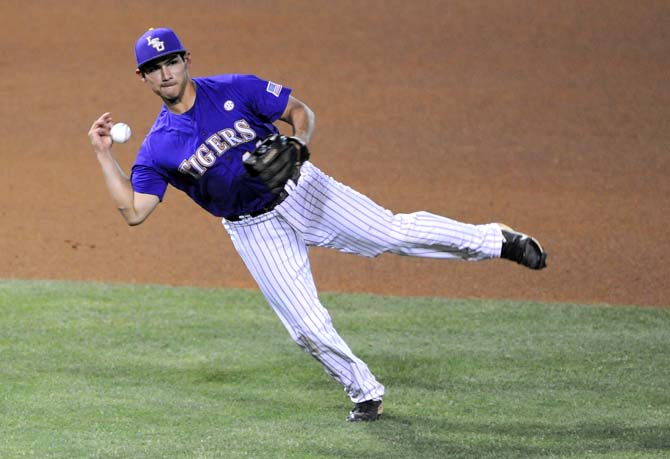 LSU junior third baseman Christian Ibarra (14) loses his grip on the baseball Saturday, April 27, 2013 during the Tigers' 4-2 loss to South Carolina in Alex Box Stadium.
 