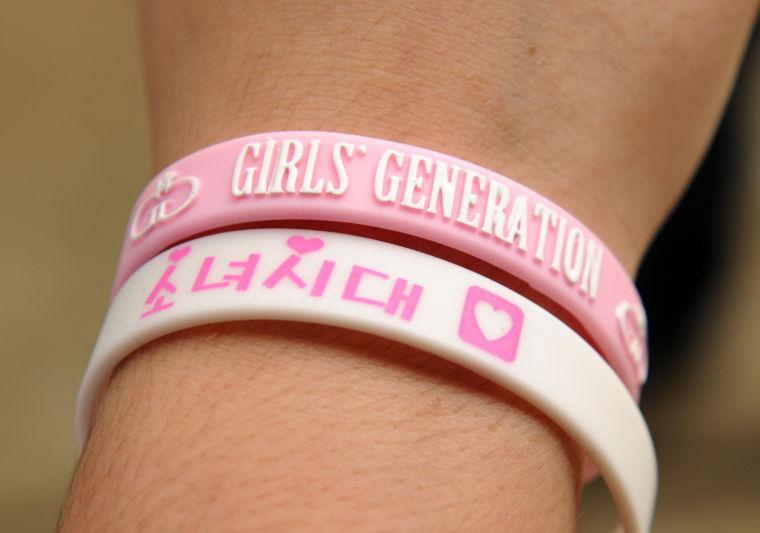 History freshman Emerson Spano wears some bracelets from her favorite Korean pop bands April 24, 2013, in the quad.
 