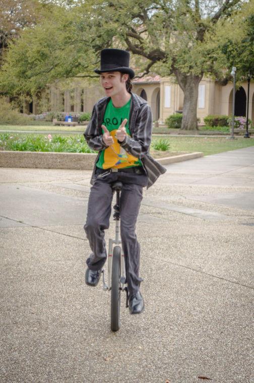 Communications studies sophomore, Adam Barnes, also known as "Unicycle Guy," "Free Hugs Guys" or "Top Hat Guy" strikes a pose for the camera.