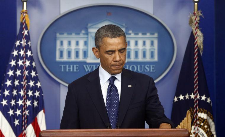 President Barack Obama pauses as he begins to speak in the James Brady Press Briefing Room at the White House in Washington, Monday, April 15, 2013, following the explosions at the Boston Marathon. (AP Photo/Charles Dharapak)
 