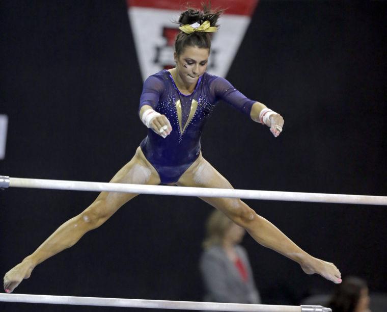 LSU's Rheagan Courville competes in the uneven parallel bars in the NCAA women's gymnastics championships in Los Angeles on Saturday, April 20, 2013. (AP Photo/Reed Saxon)
 