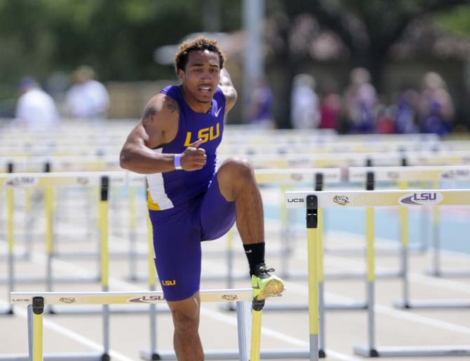 LSU sophomore Joshua Thompson knocks down a hurdle during the 100 meter hurdles Saturday, April 13, 2013.
 