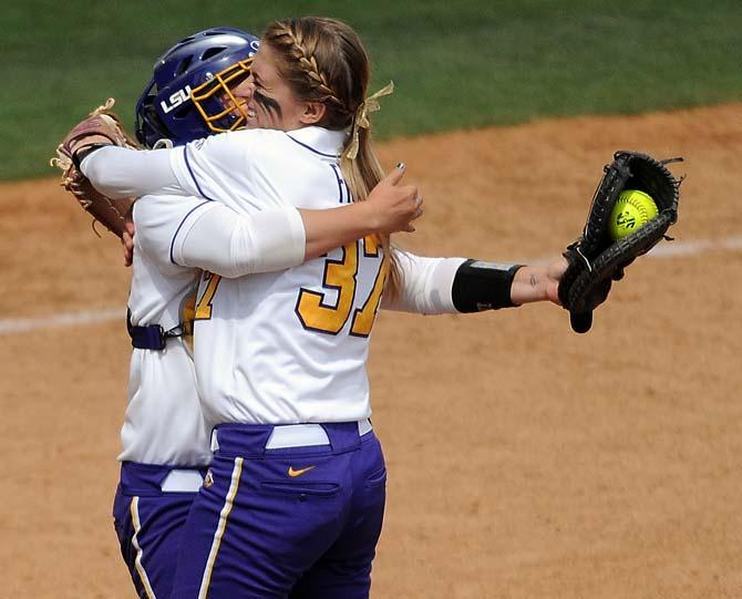 LSU senior pitcher Rachele Fico (37) hugs fellow-senior catcher Lauren Houston (16) Saturday, April 27, 2013 after the Tigers' 4-3 victory over Alabama at Tiger Park.
 