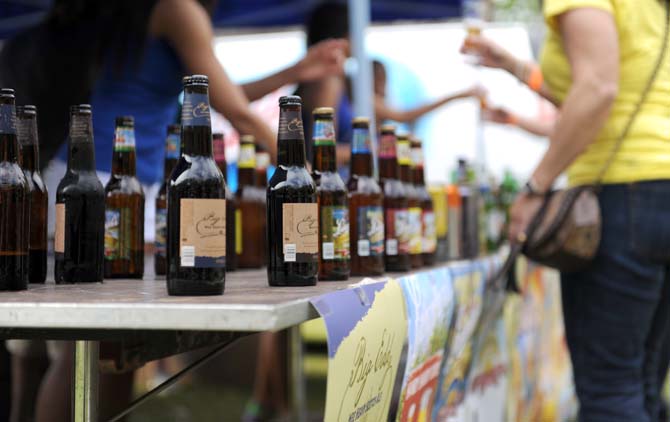 Beer bottles indicating the available selection at a vendor's station sit on display Saturday, April 6, 2013 at the 2013 Zapp's Potato Chips International Beerfest, held at the LSU AgCenter.
 