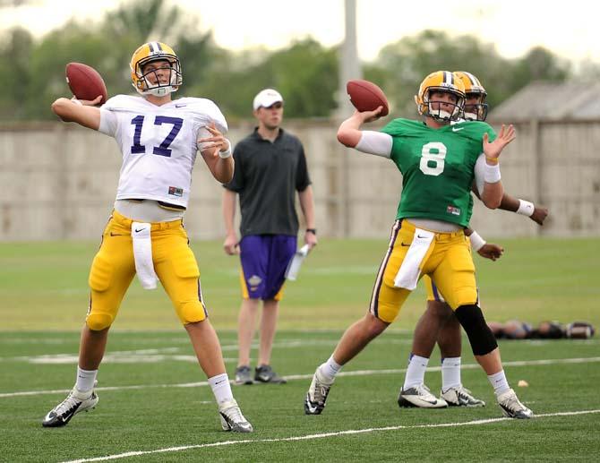 LSU sophomore quarterback Stephen Rivers (17) and senior quarterback Zach Mettenberger (8) throw downfield April 11, 2013 during football practice at the LSU Football Operations Center.
 