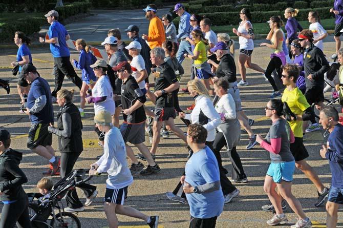 A crowd takes off Saturday, April 20, 2013, at the steps of the Louisiana State Capitol for Baton Rouge Run for Boston, a 2.62 mile run organized by several local running clubs to support victims of the Boston Marathon bombing.
 