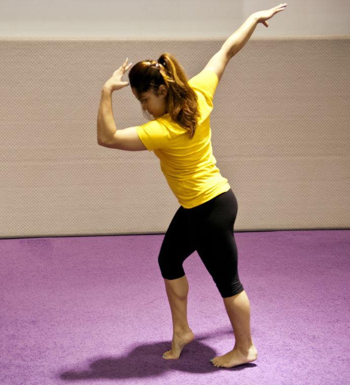 Kinesiology freshman Jessica Savona practices the "moonwalk" portion of her gymnastics routine Monday, April 15, 2013.
 