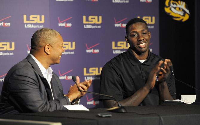 LSU sophomore forward Johnny O'Byrant III (right) and men's basketball head coach Johnny Jones (left) clap after the announcement of O'Byrant's return to LSU for his junior year Tuesday, April 9, 2013, in the Athletic Administration Building.
 