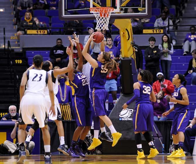 LSU junior forward Theresa Plaisance (55) gets a rebound Tuesday March 26, 2013 during the Tigers' 71-66 victory against the Lions in the PMAC.