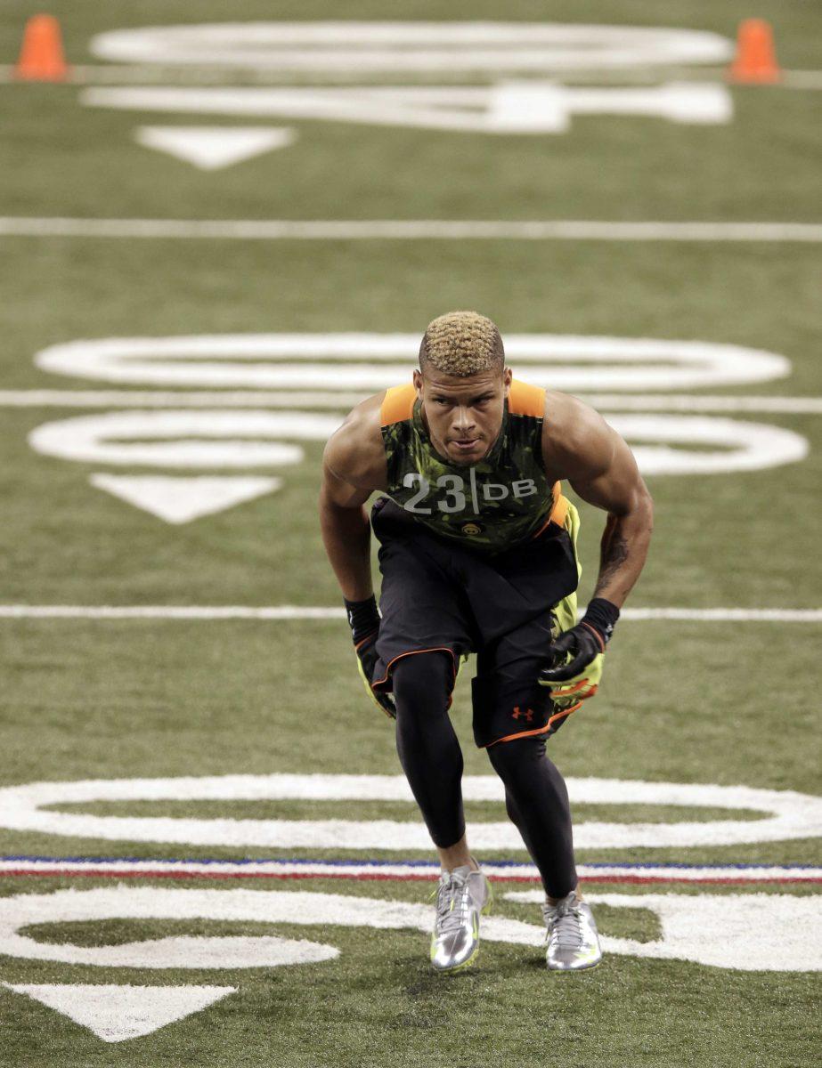 Former LSU defensive back Tyrann Mathieu runs a drill at the NFL football scouting combine in Indianapolis, Tuesday, Feb. 26, 2013. (AP Photo/Michael Conroy)