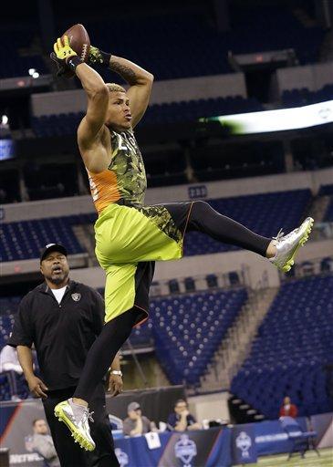 Louisiana State defensive back Tyrann Mathieu runs a drill during the NFL football scouting combine in Indianapolis, Tuesday, Feb. 26, 2013. (AP Photo/Dave Martin)
 