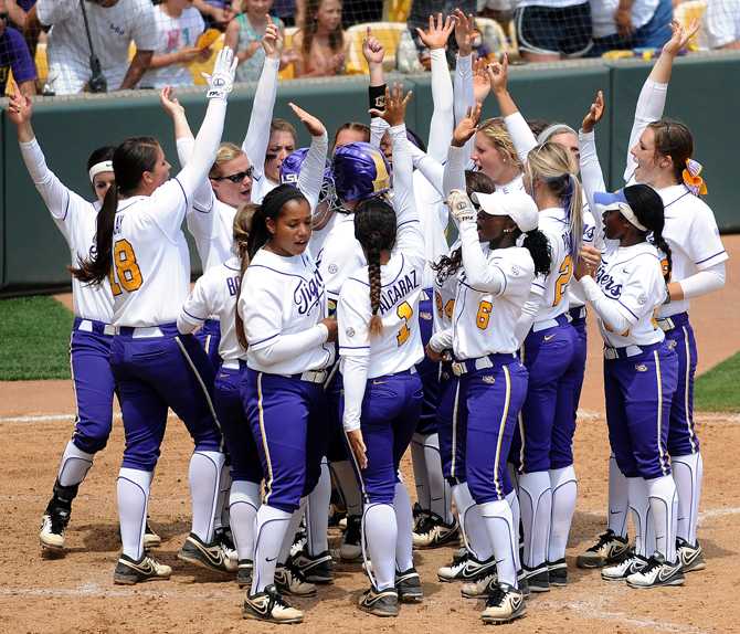 LSU softball team celebrates at the plate after freshman first baseman Sandra Simmons (3) homered Saturday, April 27, 2013 during the Tigers' 4-3 victory over Alabama at Tiger Park.
 