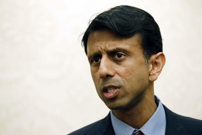 Louisiana Gov. Bobby Jindal speaks to reporters of the political common ground that he and Mississippi Gov. Phil Bryant share, Wednesday, April 3, 2013, during a media availability prior to a closed fund raising dinner for the state Republican Party in Jackson, Miss. Jindal is the main speaker at the dinner. (AP Photo/Rogelio V. Solis)
 