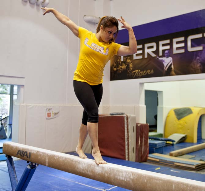 Kinesiology freshman Jessica Savona practices the "moonwalk" portion of her gymnastics routine Monday, April 15, 2013.
 