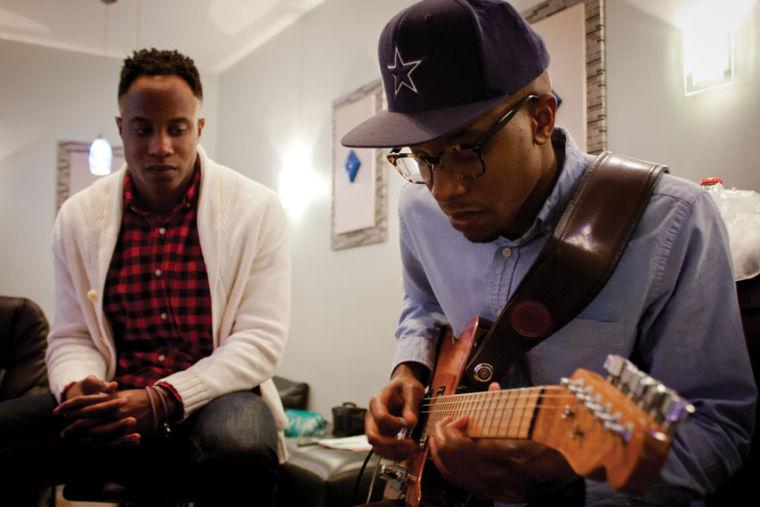 Thurman Thomas working on a guitar solo with Torrence Thomas.
 