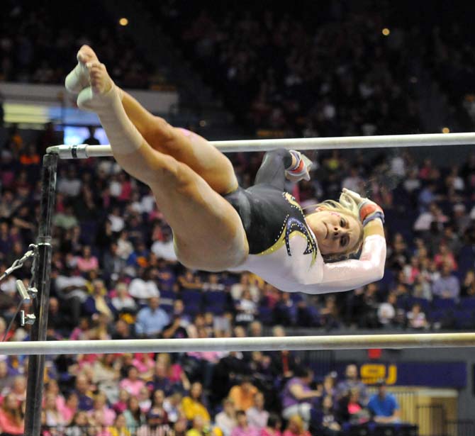 LSU junior all-around Sarie Morrison flys off the uneven bars March 8, 2013, during the Tigers' 197.500-197.725 loss against Alabama at the PMAC.