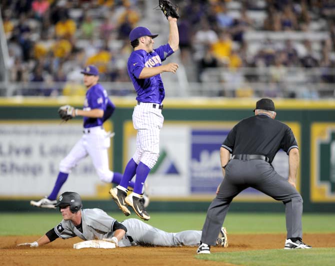 LSU freshman infielder Alex Bregman (30) jumps to catch the baseball at second base Saturday, April 27, 2013 during the Tigers' 4-2 loss to South Carolina in Alex Box Stadium.
 