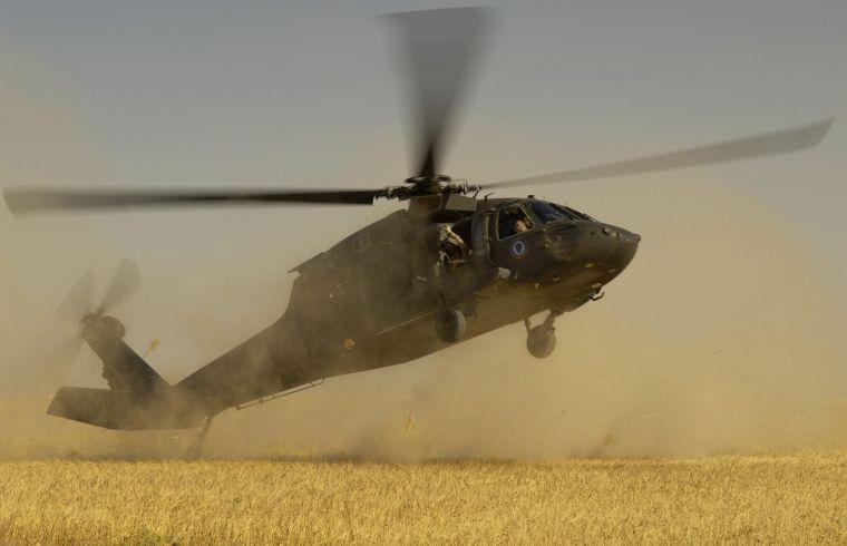 A Black Hawk helicopter touches down in Iraq. Two similar helicopters will land on campus today as part of a Bengal Raiders qualification course.
 