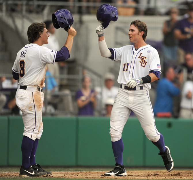 LSU senior infielder Mason Katz (8) congratulates sophomore infielder Jared Foster (17) May 31, 2013 after Foster's two-run homer during the Tigers' 11-7 win against Jackson State in Alex Box Stadium.
 