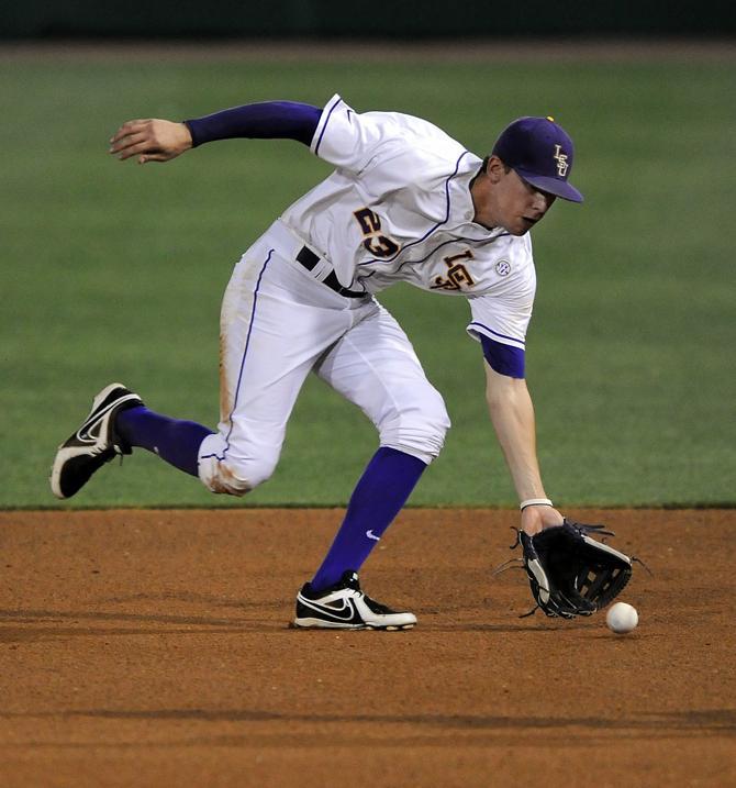 LSU junior infielder JaCoby Jones (23) fields a grounder Friday, April 26, 2013 during the Tigers' 5-2 victory over South Carolina at Alex Box Stadium.