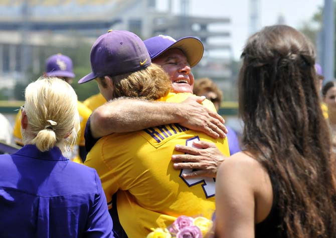 LSU head baseball coach Paul Mainieri hugs senior outfielder Raph Rhymes (4) May 18, 2013 during a pregame ceremony honoring the team's seniors in Alex Box Stadium. The Tigers would eventually lose to Ole Miss, 9-11, in the ensuing game.
 