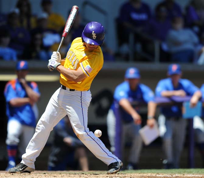 LSU junior infielder Christian Ibarra (14) is hit by a pitch Saturday, May 4, 2013, during the Tigers' 18-6 win against the Florida Gators in Alex Box Stadium.
 