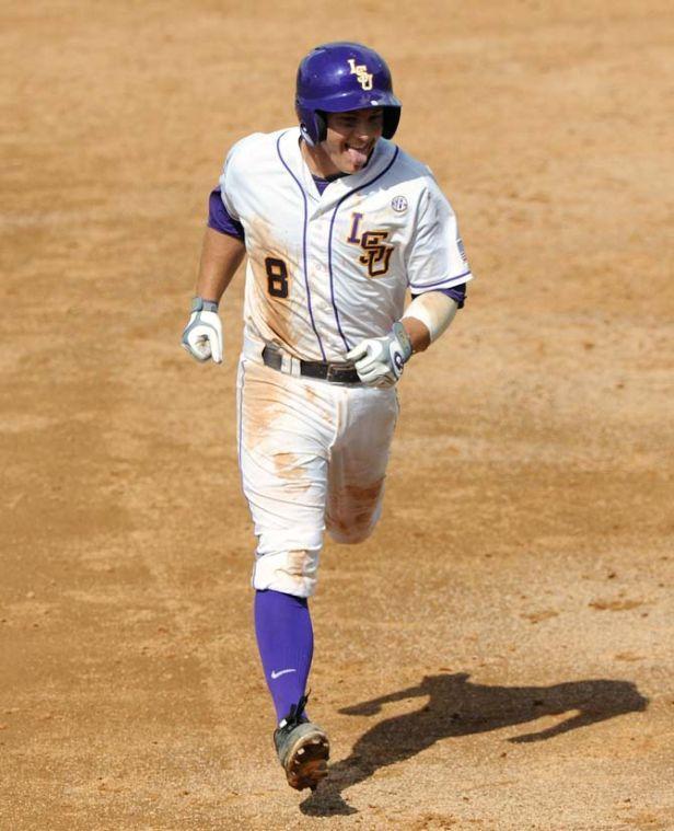 LSU senior infielder Mason Katz (8) sticks his tounge out as he rounds the bases following his home run during the Tigers' 11-7 win against Jackson State in Alex Box Stadium.
 