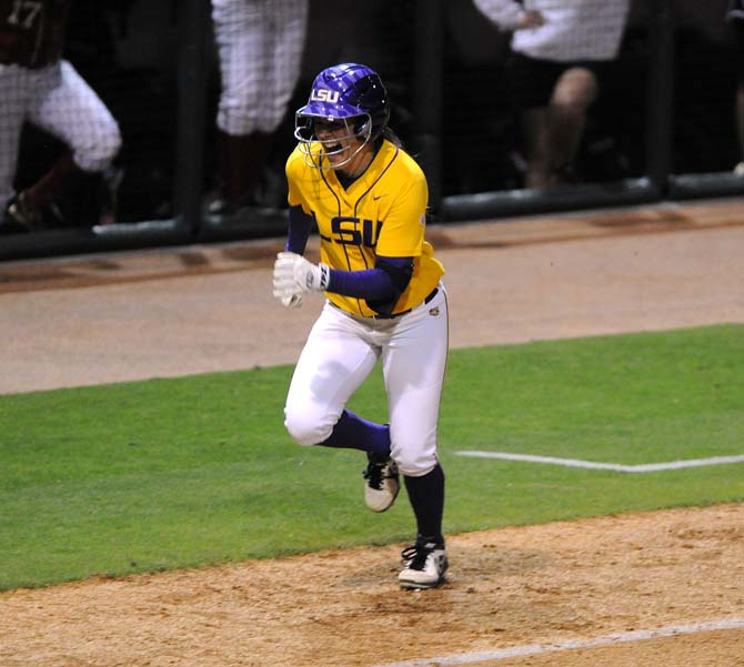 Junior utility player Allison Falcon makes a homerun on Thursday, April 25, 2013 during the LSU vs. Alabama softball game in Tiger Park.
 