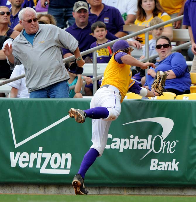 LSU senior first-baseman Mason Katz (8) leans over the barricade to catch the ball April 28, 2013 during LSU's 4-0 lost to South Carolina in Alex Box Stadium.