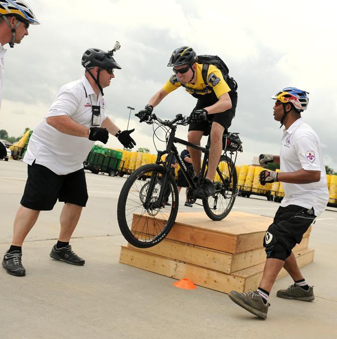 An officer drops off an obstacle Thursday, May 2, 2013 during the Mad March Racing intermediate class.
 