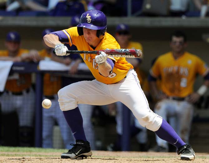 LSU freshman outfielder Andrew Stevenson (6) lays down a bunt May 18, 2013 during the Tigers' 9-11 loss to Ole Miss in Alex Box Stadium.
 