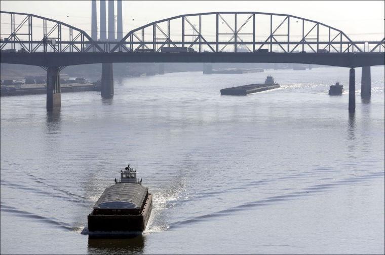 Barges power their way up the Mississippi River on Friday in St. Louis. (AP Photo/Jeff Roberson)
 