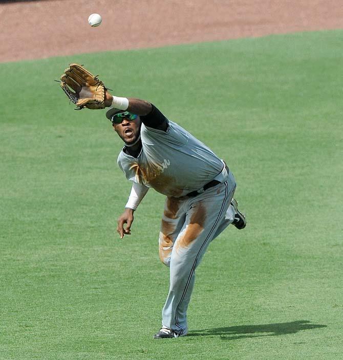 Jackson State junior outfielder Jason Tillery (8) stretches to catch a fly ball May 31, 2013 during the team's 7-11 loss to LSU in Alex Box Stadium.
 