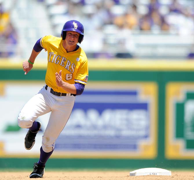 LSU freshman outfielder Andrew Stevenson (6) rounds second base May 4, 2013 during the Tigers' 18-6 win against the Florida Gators in Alex Box Stadium. LSU scored 18 runs on 19 hits during the third game of their sweep of the Gators.
 