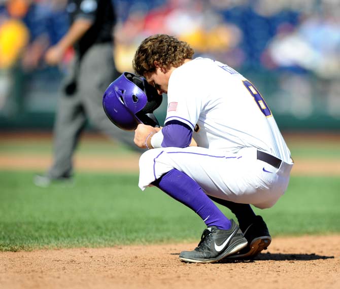 LSU senior first-baseman Mason Katz (8) bends down to mourn LSU's 2-4 loss to UNC June 18, 2013 at the College World Series in TD Ameritrade Park.
 