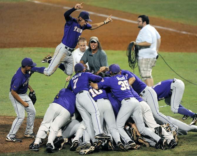 The LSU baseball team dogpiles June 8, 2013 after the Tigers secured a ticket to the College World Series with an 11-1 victory against Oklahoma in Alex Box Stadium.
 