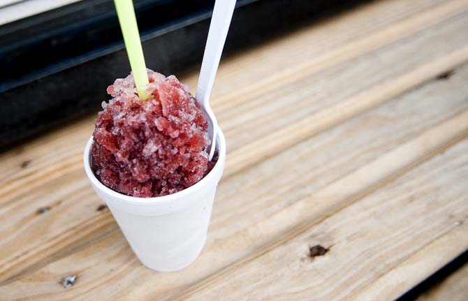 A blackberry flavored snoball sits on a bench June 25, 2013 outside of Zydeco Sneaux.