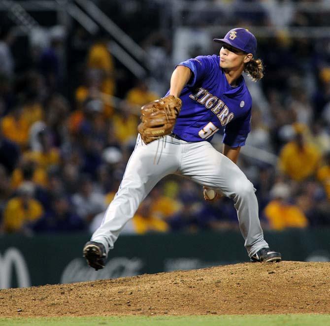 LSU senior left-handed pitcher Chris Cotton (58) winds up to pitch the ball to home plate June 8, 2013 during the Tigers' 11-1 victory over Oklahoma in Alex Box Stadium.
 