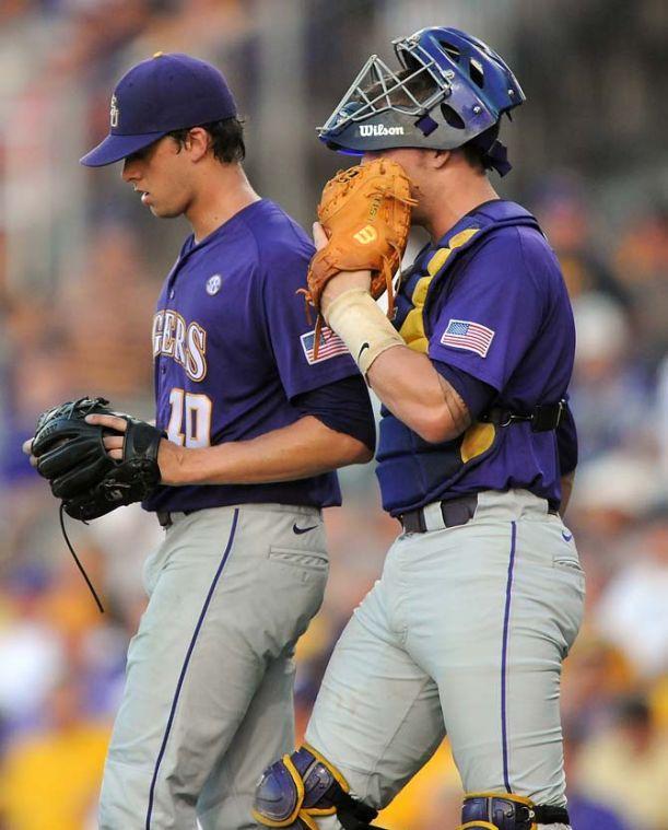 LSU junior catcher Ty Ross (26) talks with sophomore pitcher Aaron Nola (10) June 1, 2013 during the first inning of the Tigers' 8-5 win against Sam Houston in Alex Box Stadium. In the inning, Nola allowed five unearned runs and the Tiger defense commited three errors.
 